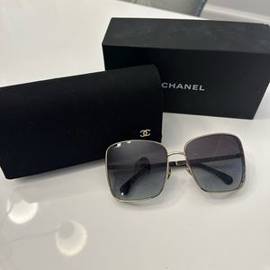Chanel gold frame sunglasses. Excellent condition. Comes with box and case.